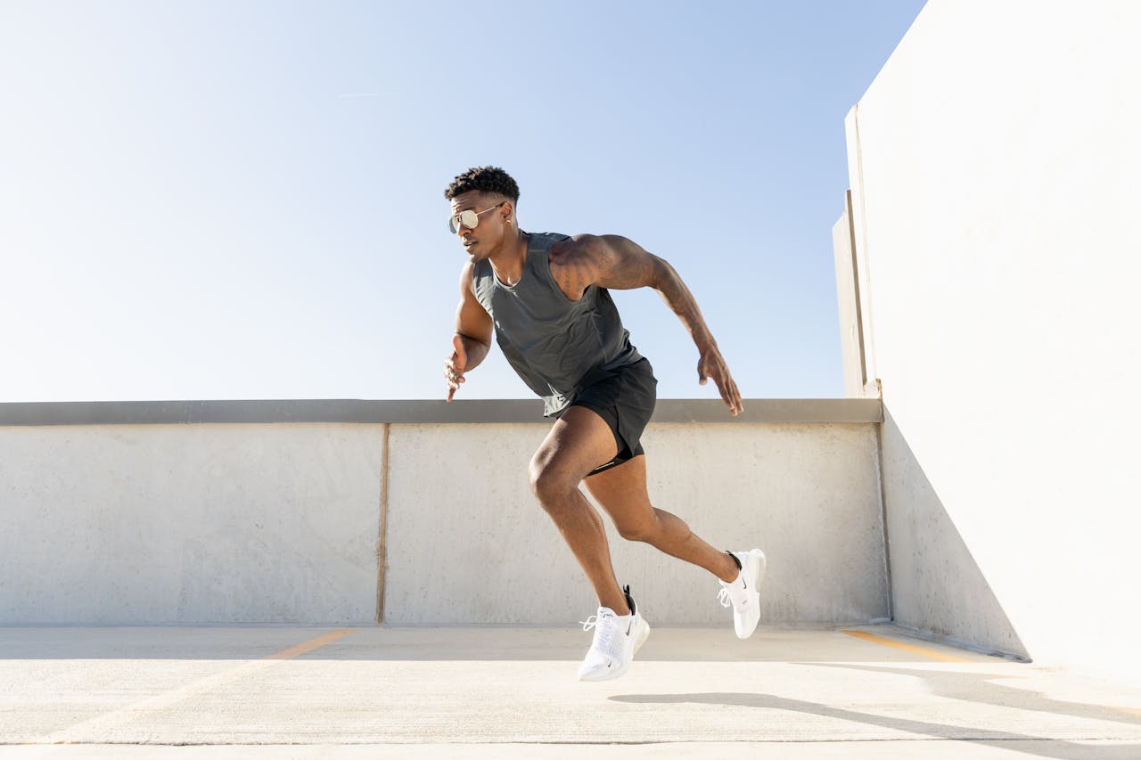 home-hero-bg Dynamic image of a man sprinting on a building rooftop, showcasing athleticism and urban lifestyle.
