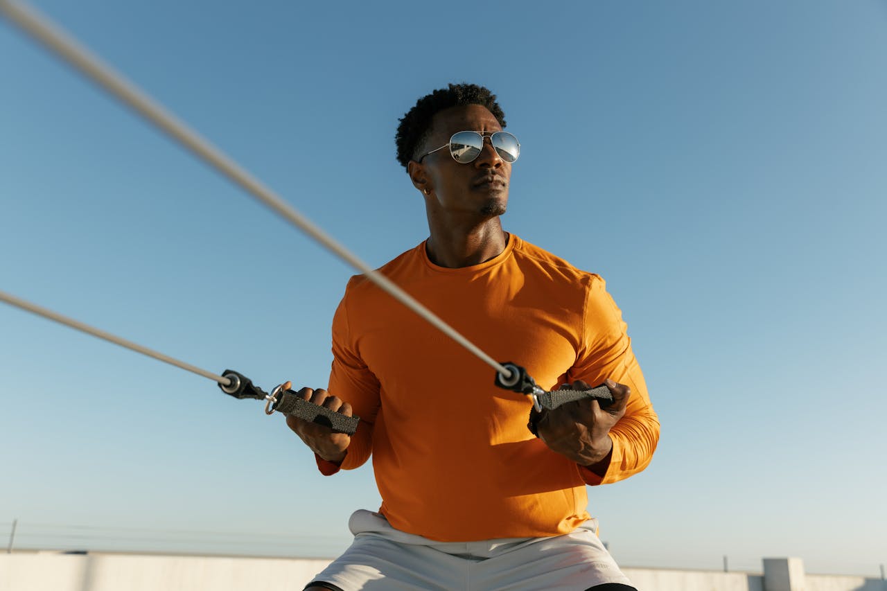 home-services-02 Dynamic photo of a man exercising on a rooftop in Austin, Texas, embodying urban fitness and style.